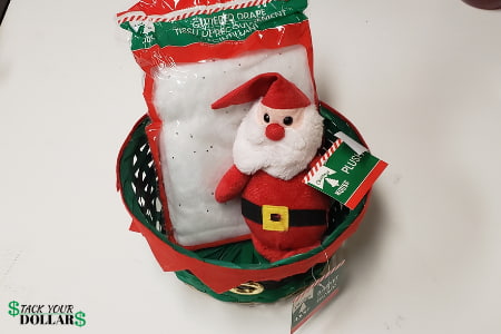 Supplies to make a Christmas gift basket: Santa plushie, snow drape, basket