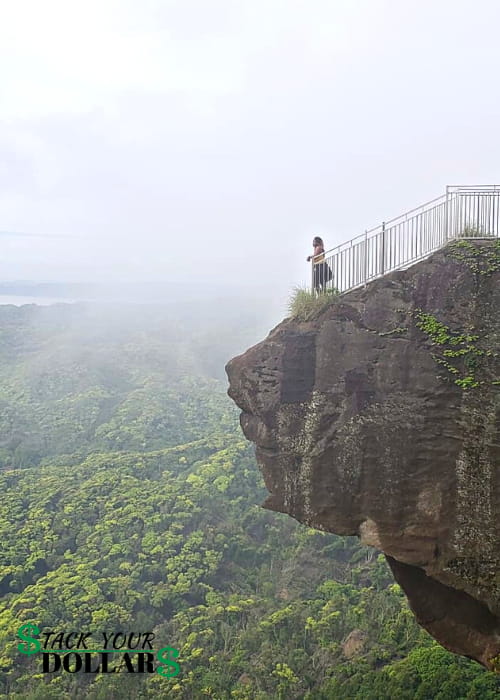 Woman peering from Hell Peak